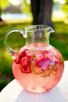 strawberry drink in glass pitcher